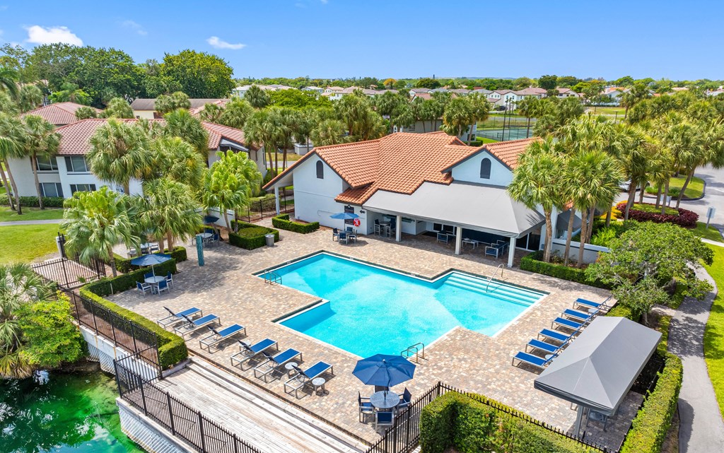A large house with a pool in the backyard.